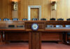 Interior view of a Senate chamber with a wooden podium and seating