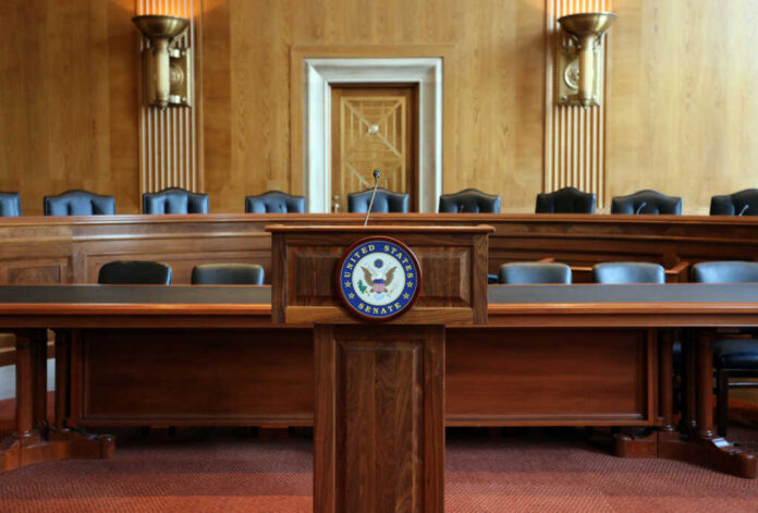 Interior view of a Senate chamber with a wooden podium and seating